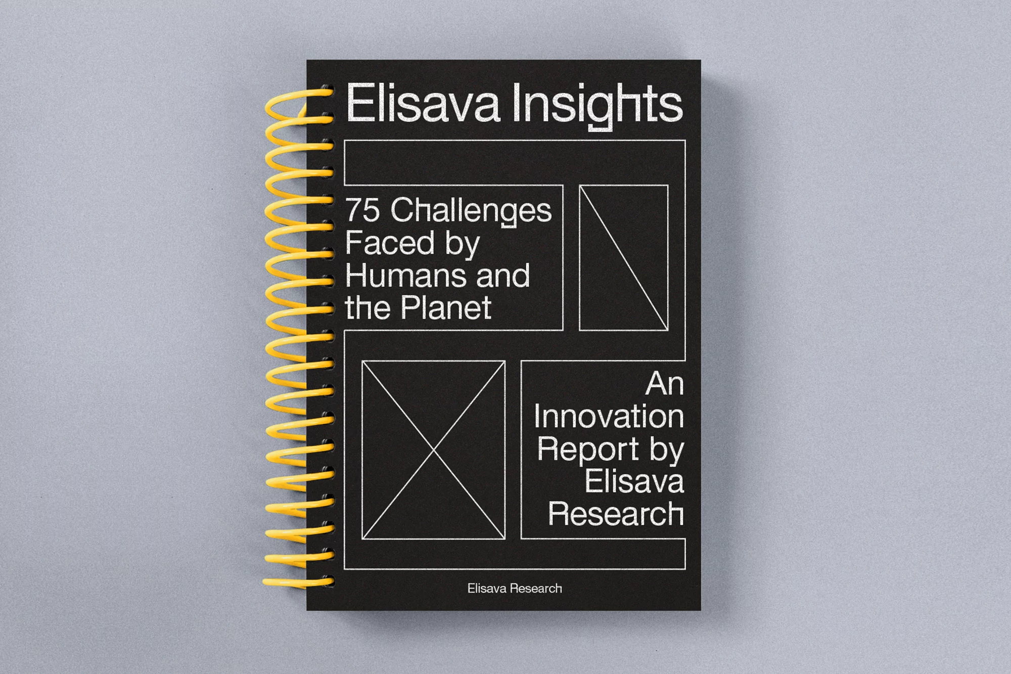 Black cover of the 'Elisava Insights' innovation report with a yellow spiral binding, lying on a light gray surface.