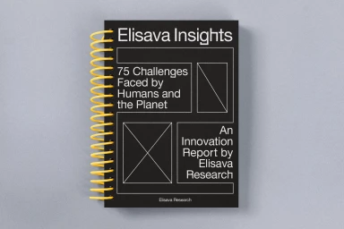A black spiral-bound report book titled Elisava Insights resting on a neutral grey surface.