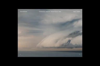 Web interface mockup for Studio Blackbird featuring a rolling cloud formation over the sea and minimalist navigation links