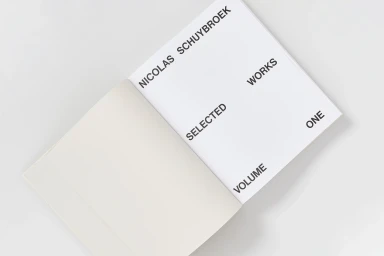 An open monograph book titled Nicolas Schuybroek Selected Works Volume One on a neutral white background