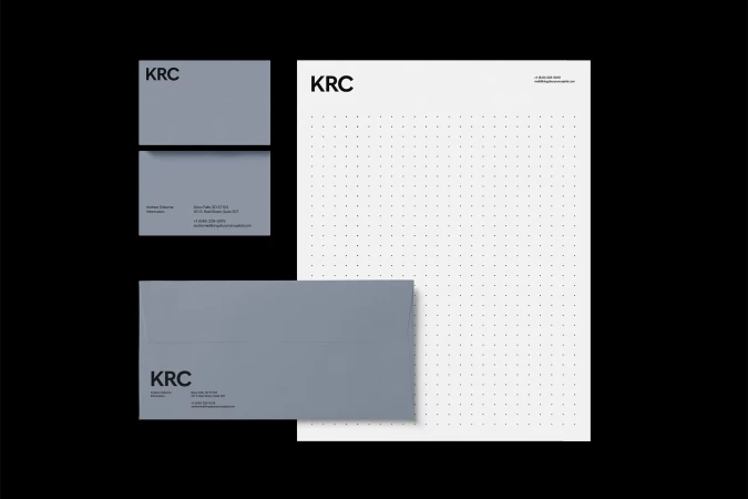 Stationery mockup featuring business cards, an envelope, and letterhead with a simple, modern design and the KRC logo. Presentation.