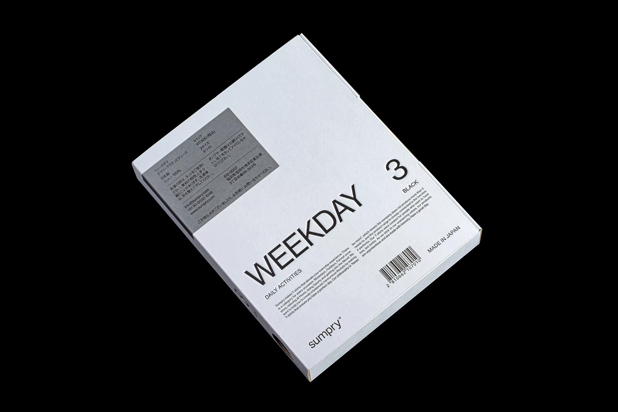 Angled shot of a white Weekday brand box with black lettering on a black background. The box contains product information and a barcode.