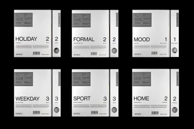 Six minimalist white packaging boxes for SUMPRY featuring bold black typography and barcodes on a solid black background