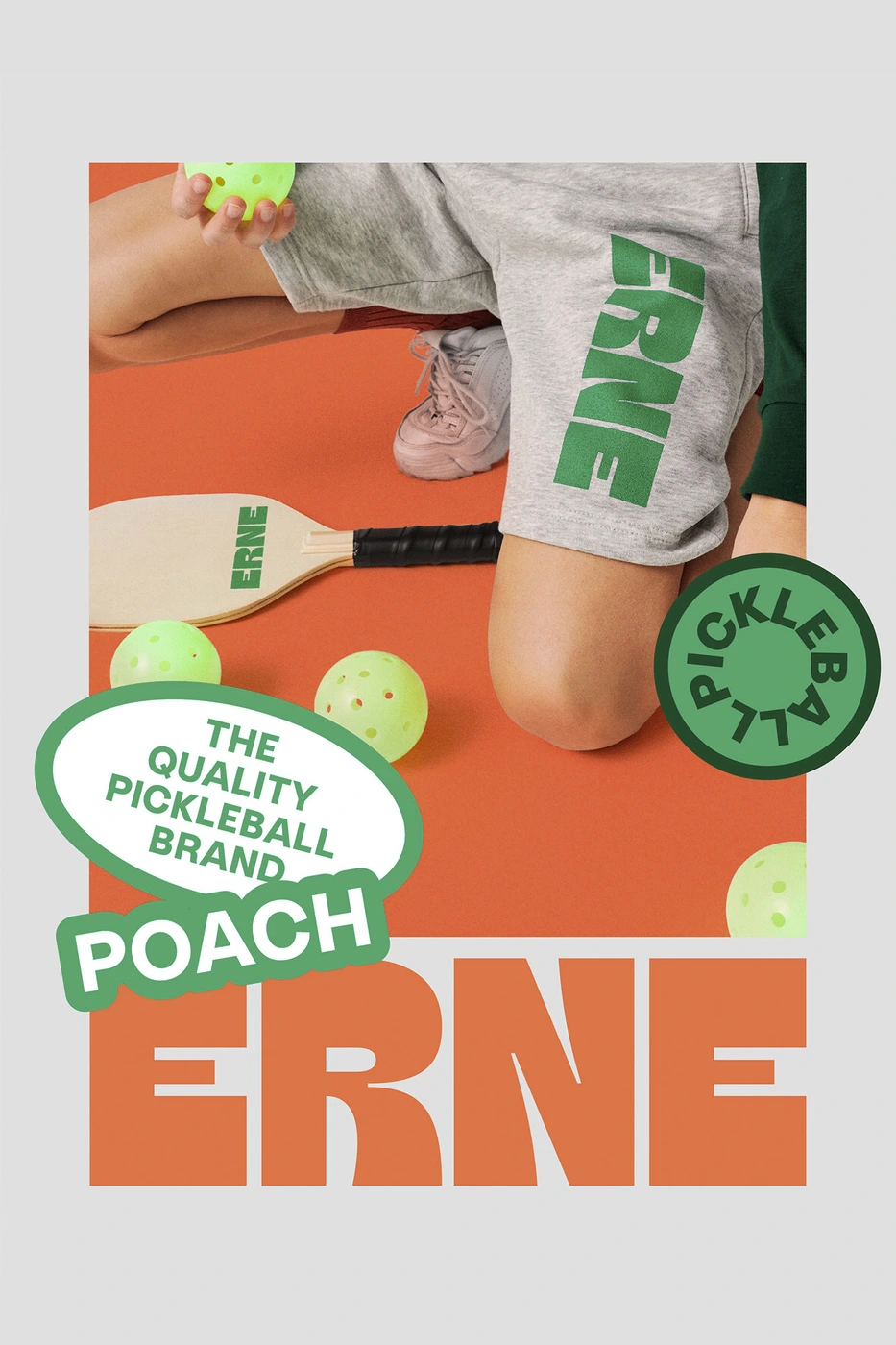Person holding pickleballs next to a paddle and branded shorts on an orange and grey background