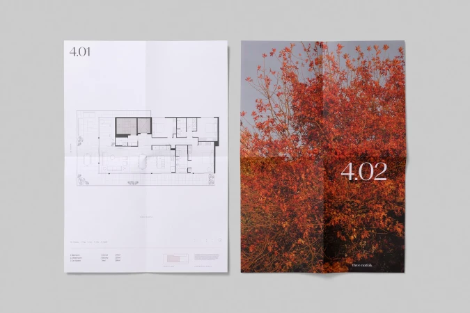Two architectural plans, one a floor plan, the other a tree in fall color, both on white paper against a gray background.