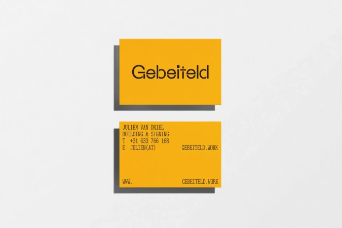 Two yellow business cards for Gebeiteld displayed on a light textured background with soft drop shadows.