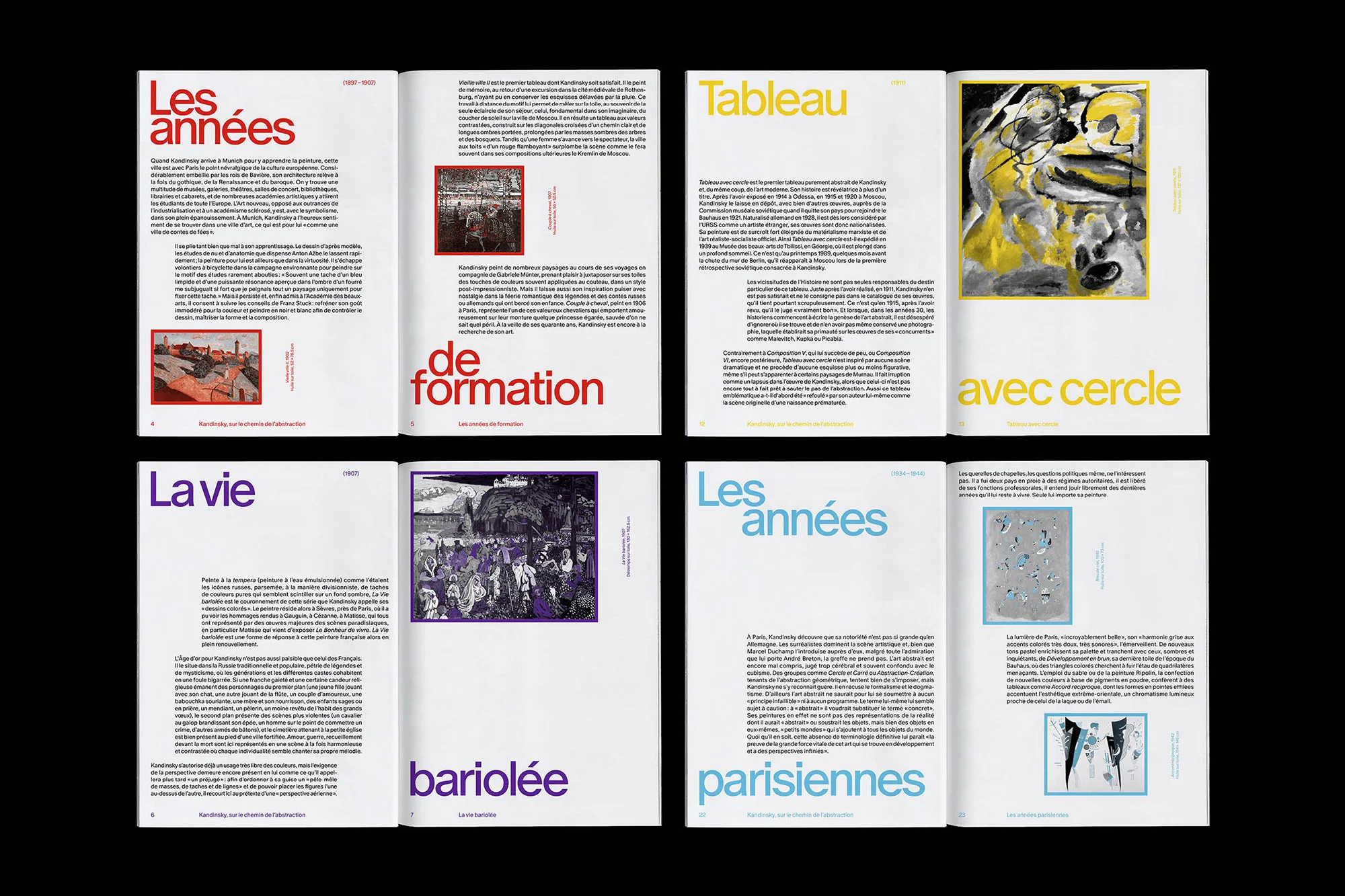 Open book with colorful text and images, featuring artistic layouts and design elements on white pages against a dark background.