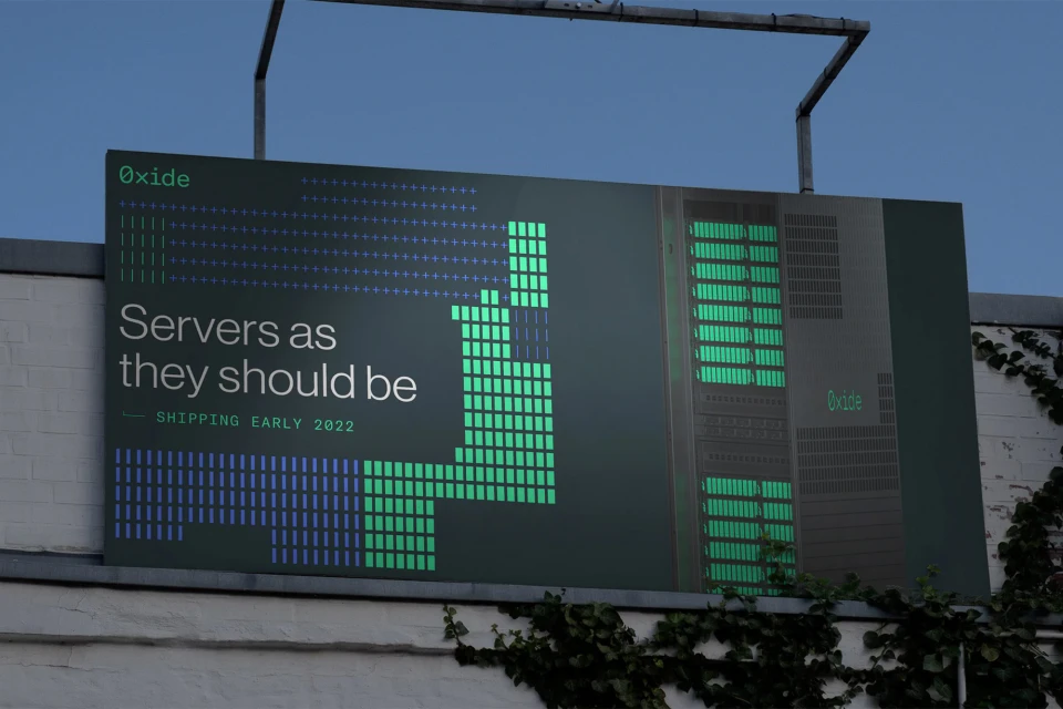 Oxide server billboard featuring servers and tech industry branding against a clear sky, promoting technology and server solutions.