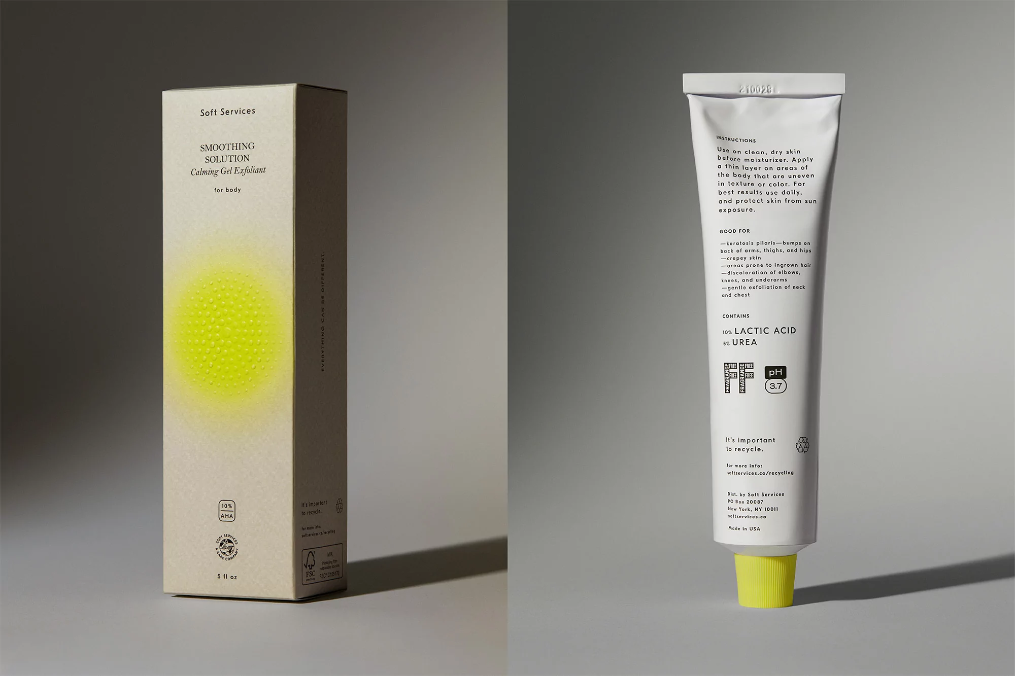 Cosmetic product photography featuring a 'Soft Services' smoothing solution box and a tube of calming gel exfoliant on gray.