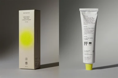 Product packaging for Soft Services smoothing solution featuring a box and tube on a grey background