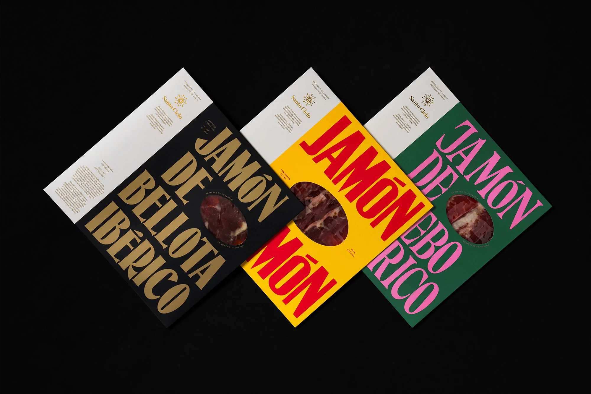 Three packages of jamón ibérico arranged against a black background featuring bold lettering and product view windows.