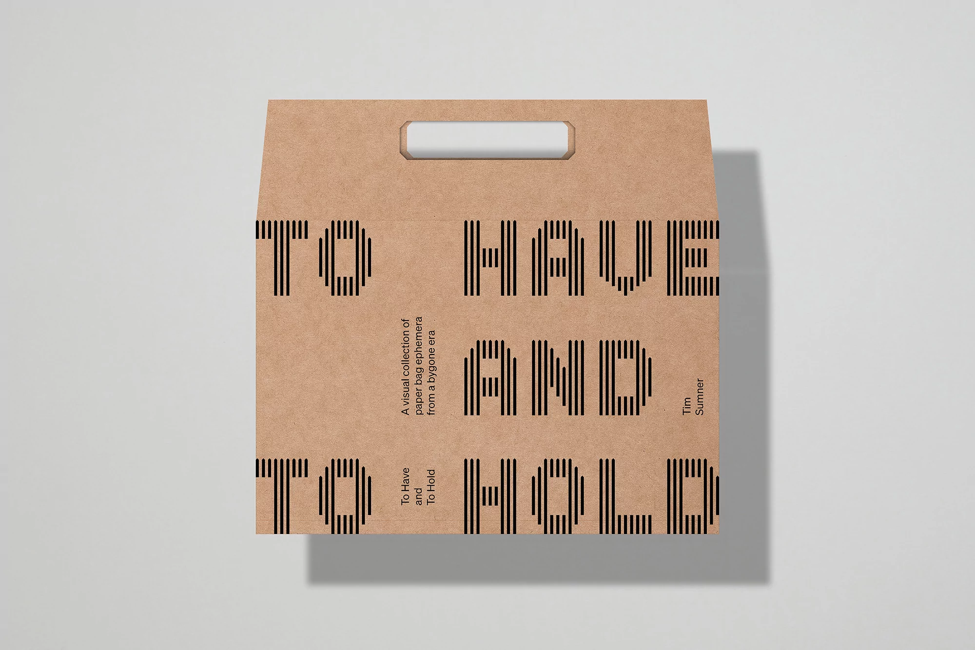 Tan paper bag with black text that reads 'To Have and To Hold,' a visual collection of paper bag ephemera from a bygone era.