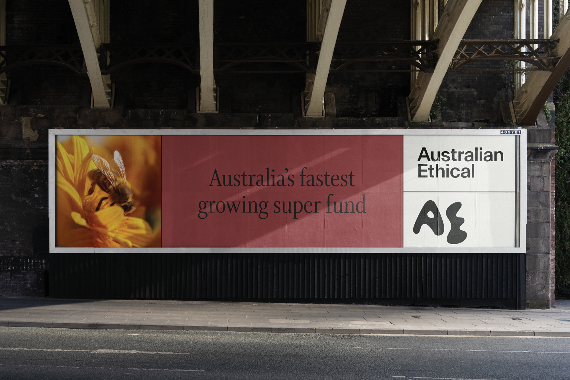 Billboard advertisement featuring a bee on a yellow flower and promotional text for Australian Ethical super fund.