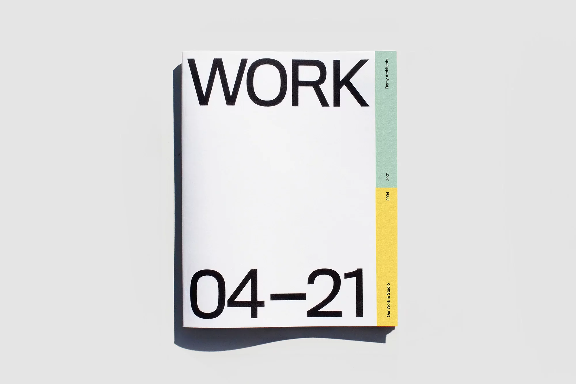 Booklet cover design featuring bold typography with the word WORK and digits 04-21 against a clean white background.