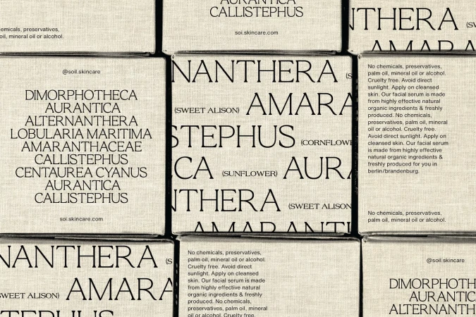 An overhead shot showcases neatly arranged boxes featuring botanical names and product details, reflecting a clean aesthetic and skincare theme.