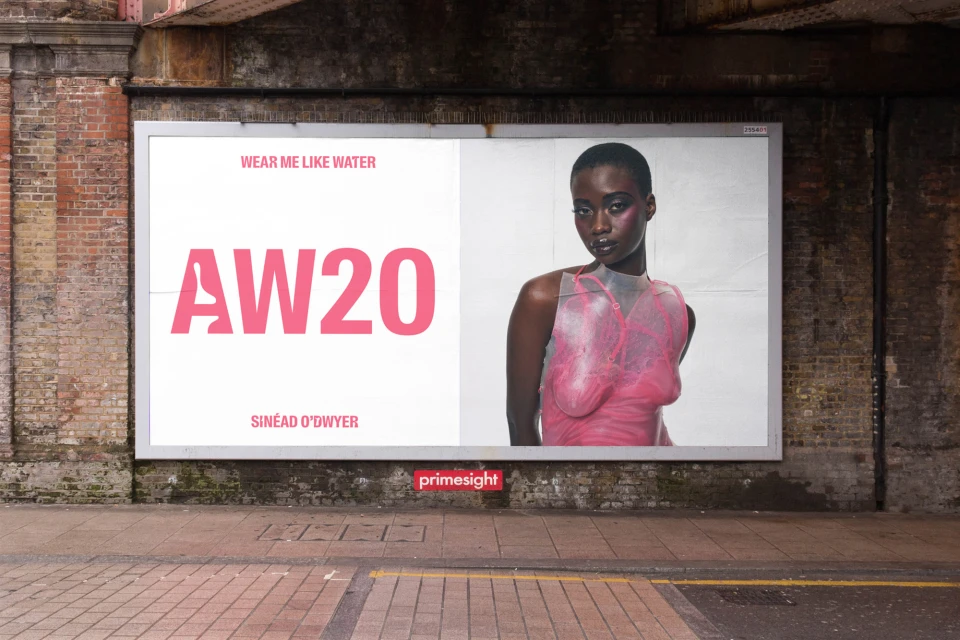 Fashion billboard featuring an African-American model wearing a pink, transparent dress with AW20 text and brand name Sinéad O'Dwyer.