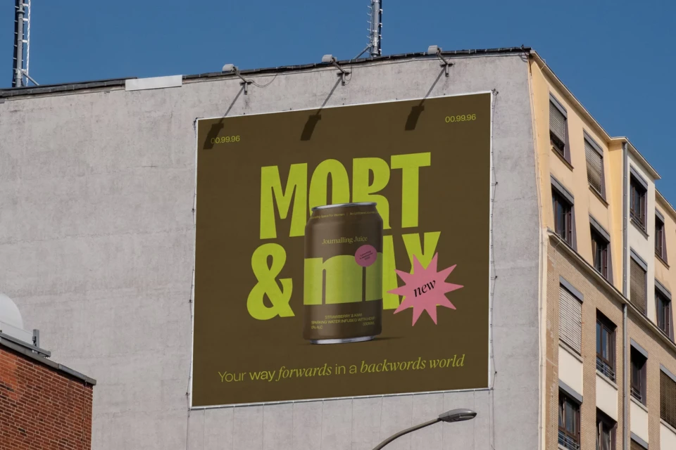 Billboard advertisement for Mort & Mlx beverage on the side of a building featuring a green and brown color scheme under a blue sky.