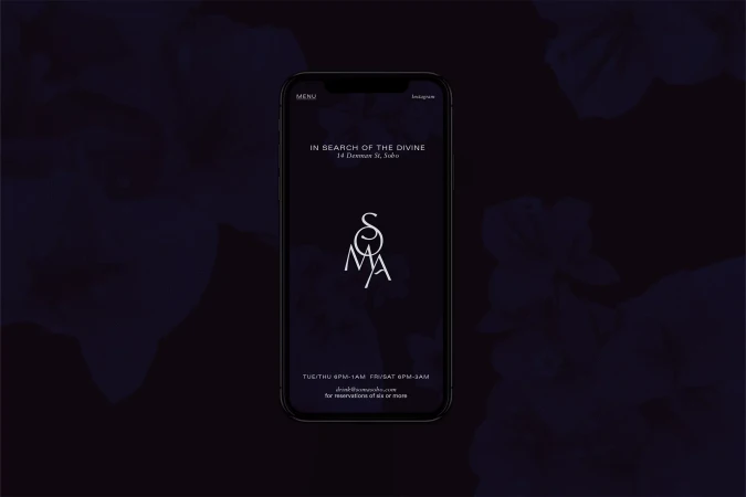 Soma Soho restaurant advertisement displayed on a black smartphone with digital menu featuring the logo, address, and operating hours.