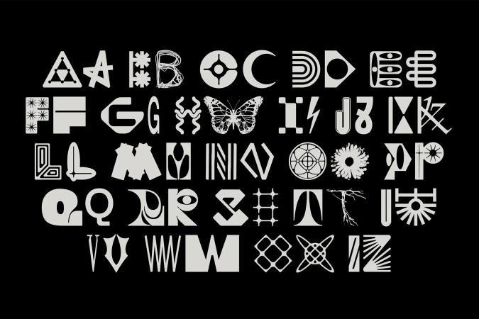 Custom typographic alphabet sheet with intricate, stylized white glyphs and symbols on a solid black background.