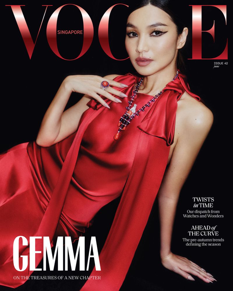 Vogue Singapore cover featuring a woman in a red dress with jewelry, posing against a black background, magazine title visible.