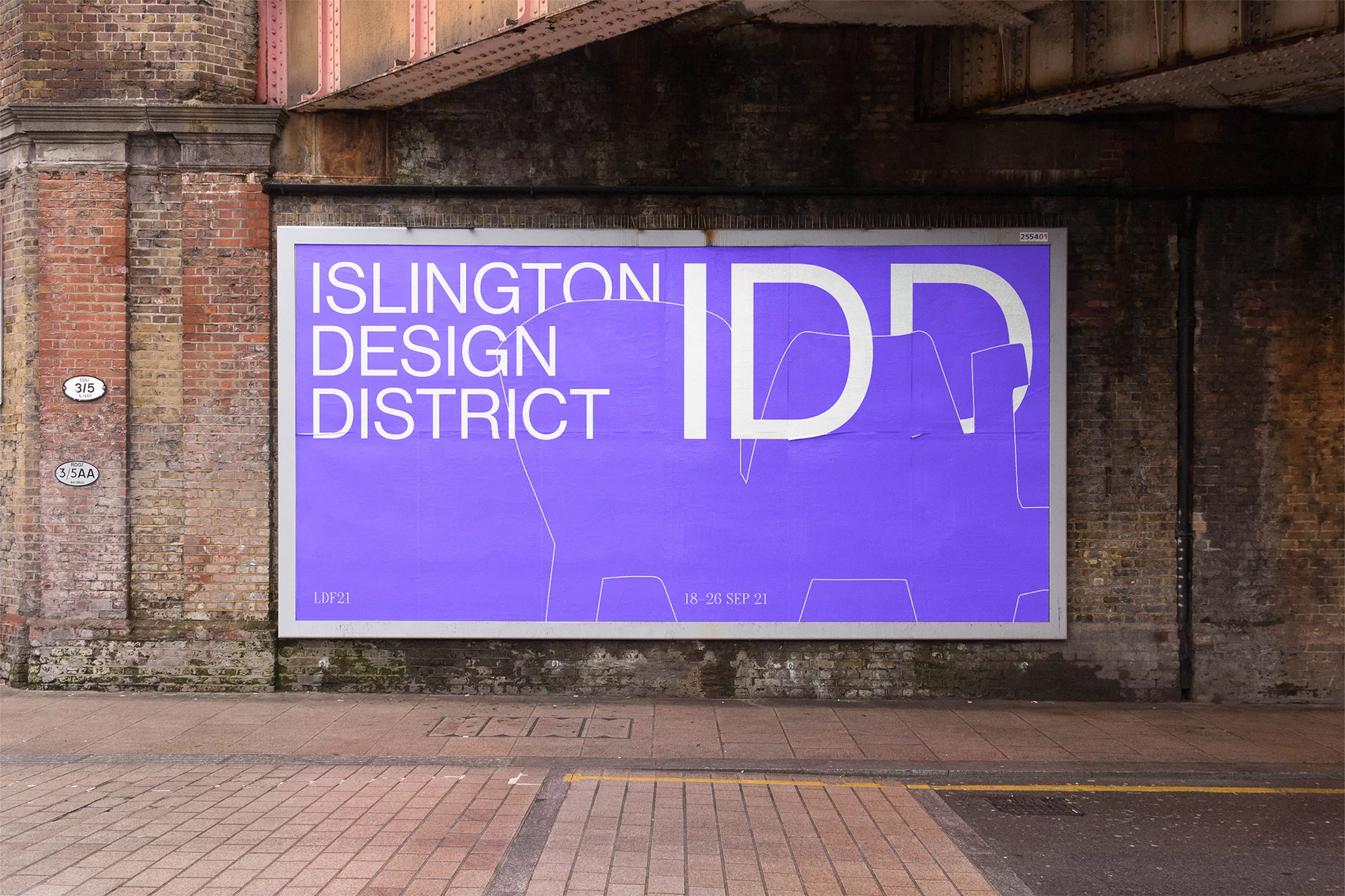 Outdoor advertising billboard for the Islington Design District, featuring a purple background, white lettering, and geometric outline art.