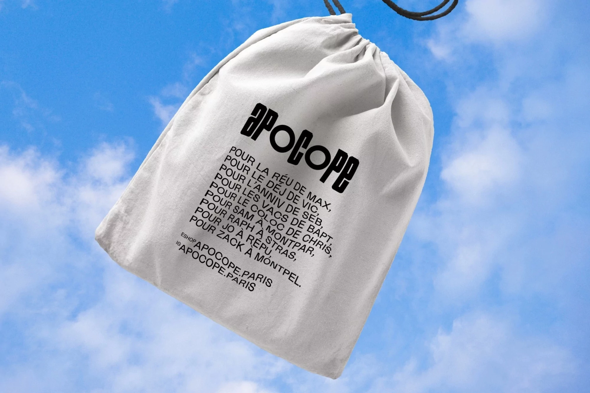 Cotton drawstring bag with black text on blue sky backdrop with clouds. Graphic text displays the brand name and product details.