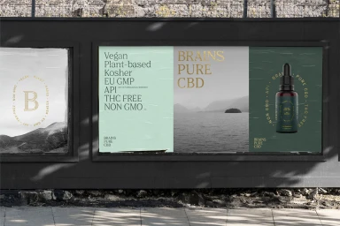 Outdoor advertising billboard displaying Brains Pure CBD branding, product packaging, and typography against a dark wall