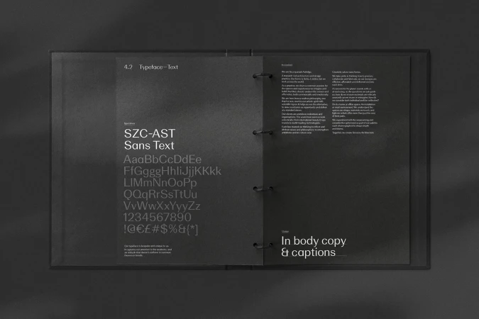 Open portfolio book displays a modern sans-serif typeface called SZC-AST Sans Text with upper and lowercase letters, numbers, and symbols.