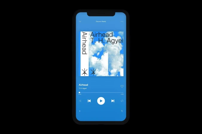 Smartphone screen featuring music app with album art displaying title, artist, and cloudy sky background. Blue color scheme.