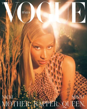 Portrait of Nicki Minaj featuring blonde hair and patterned dress for a Vogue Italia magazine cover