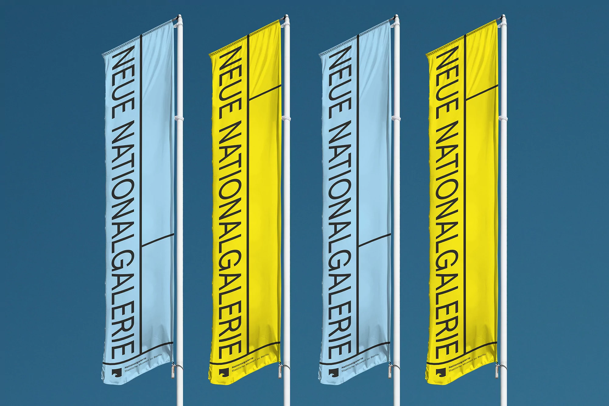 Four vertical flags with 'Neue Nationalgalerie' text against a clear blue sky, creating a minimalist outdoor display.