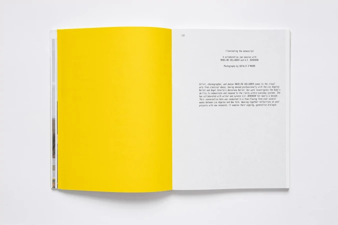 Open book with a bright yellow page on the left and text on the white page on the right. Studio shot, top down angle.