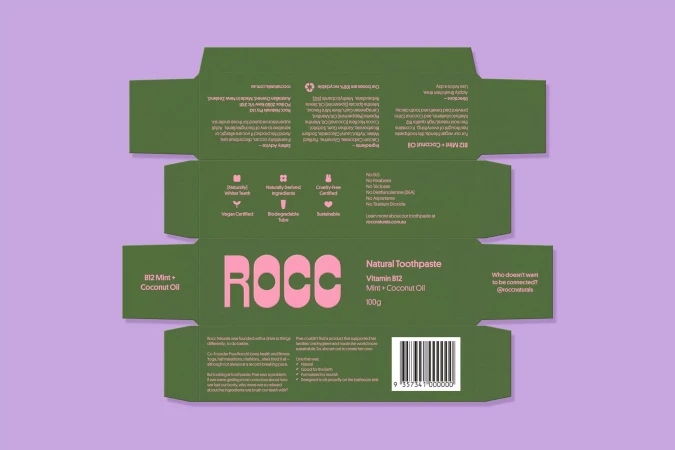 ROCC natural toothpaste box in green and pink with a minimalist design, advertising its vitamin B12 and coconut oil ingredients.