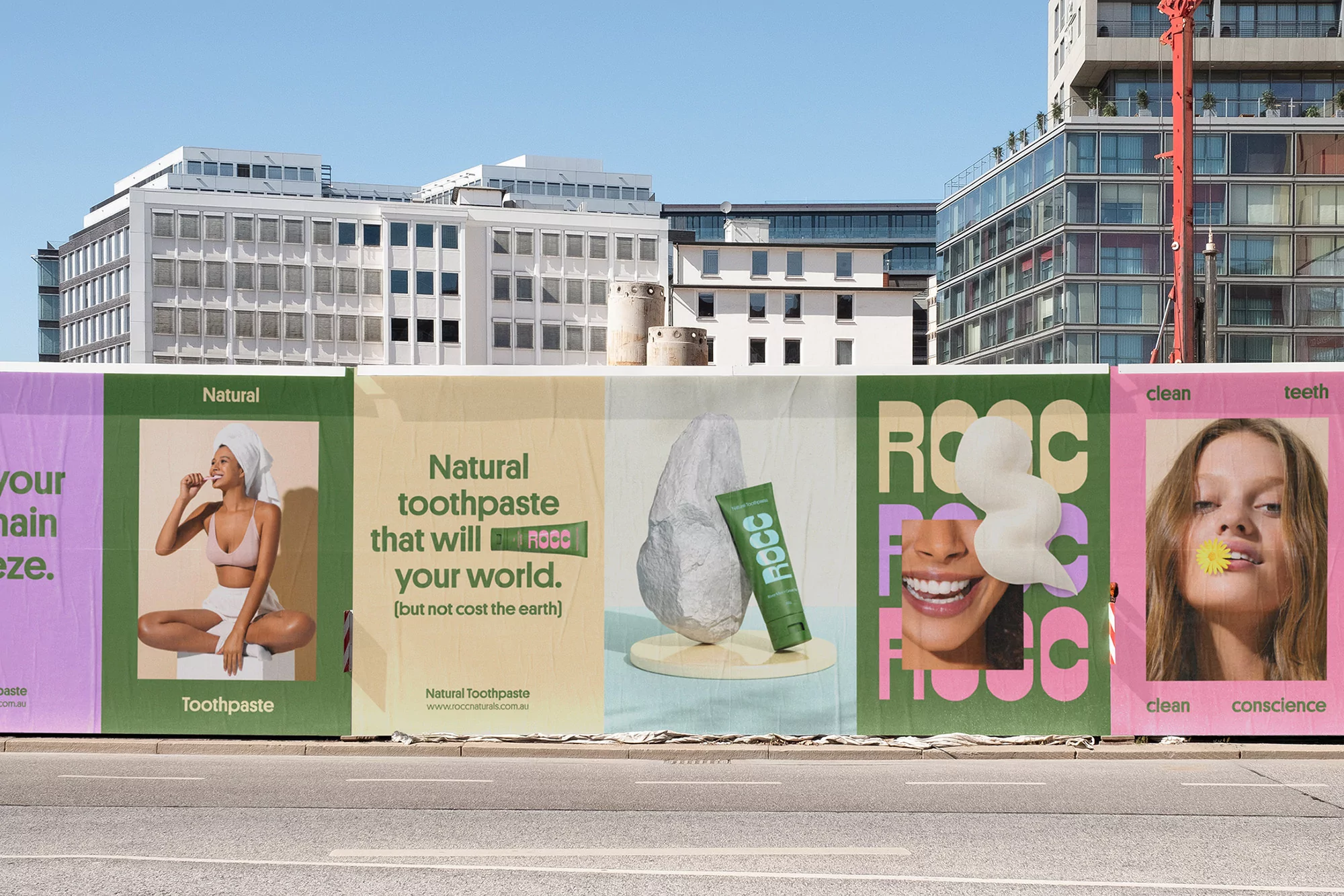ROCC brand identity billboard advertisement on a city street showing colourful panels with toothpaste products, models, and typography.
