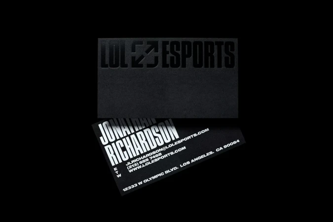Two black business cards featuring white text for LOLEZESPORTS and Jonathan Richardson, set against a dark black background.