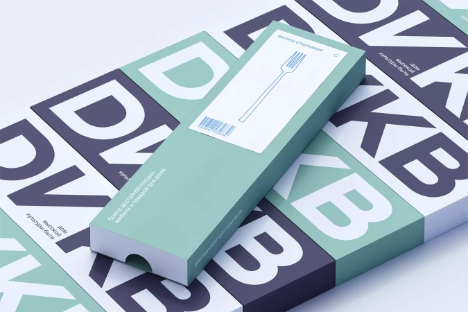 Boxed fork with illustration on block letter backdrop. Tableware packaging, creative design, and clean product presentation.
