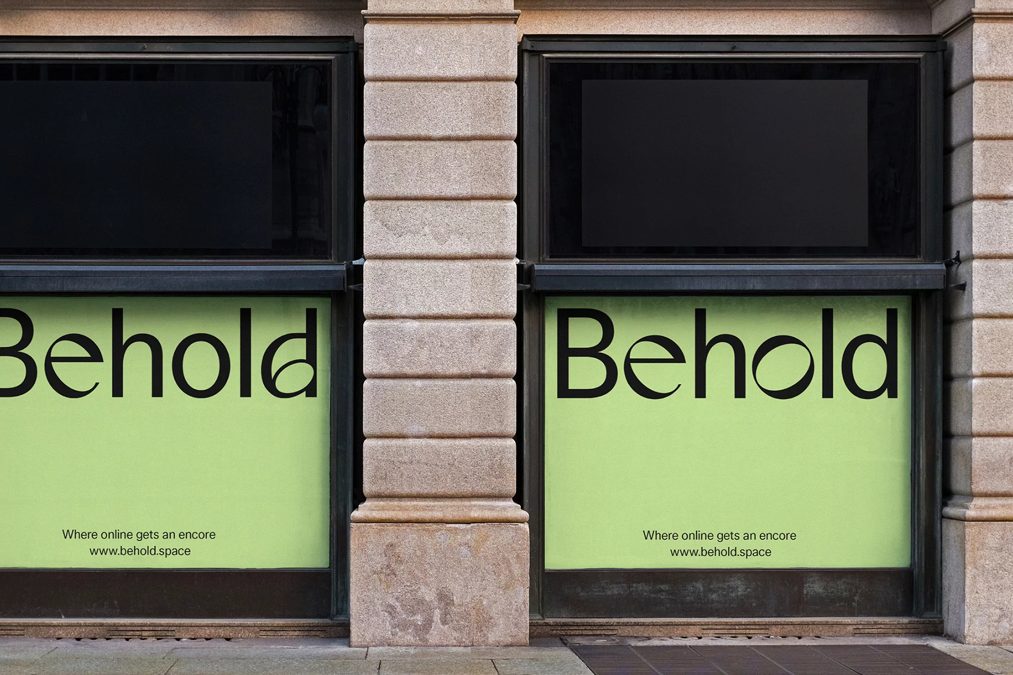 Storefront view featuring a 'Behold' advertisement, with a clean aesthetic and minimalist design in black and green, promoting online services.