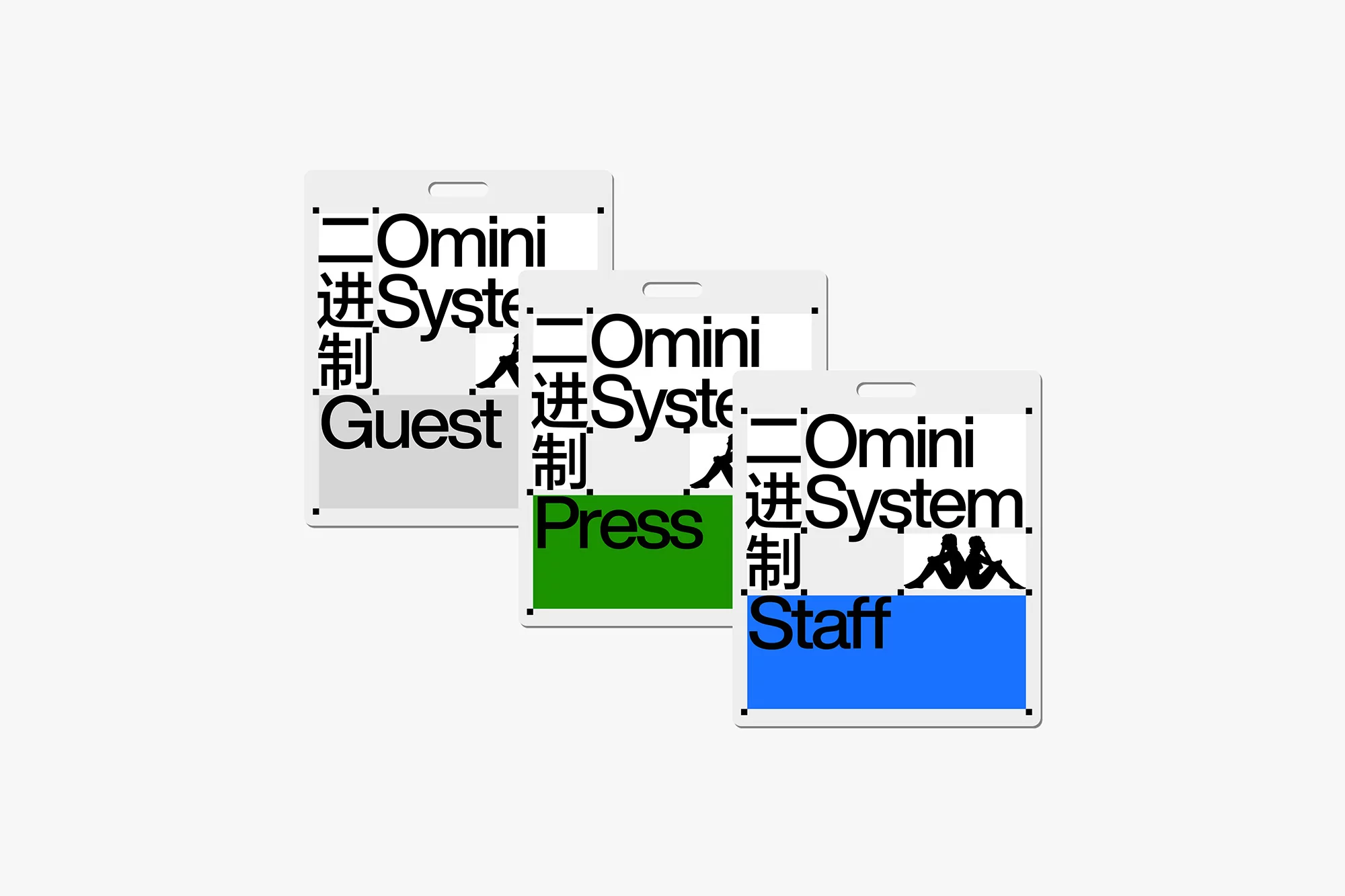 Three branded white badges with color blocks featuring the words 'Guest,' 'Press,' and 'Staff' against a light grey background.