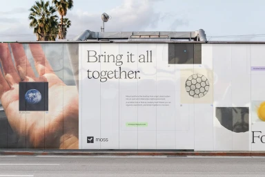 Outdoor billboard display for Moss brand identity featuring large typography and graphic elements