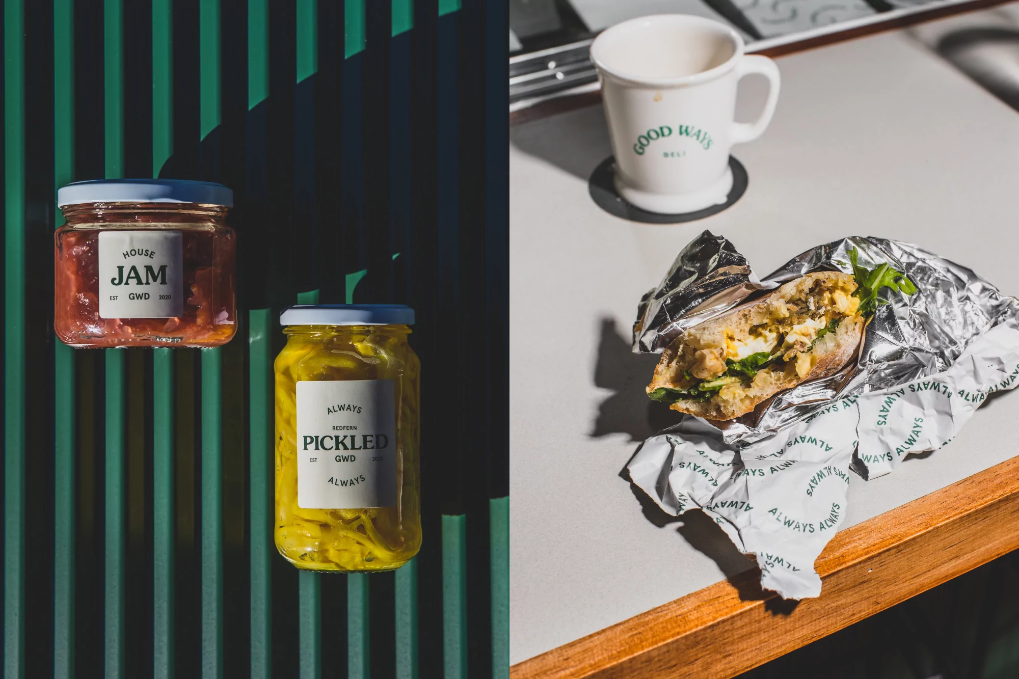 Still life of jam and pickles in glass jars, and a foil-wrapped sandwich with a mug on a table, showcasing food photography and product display.