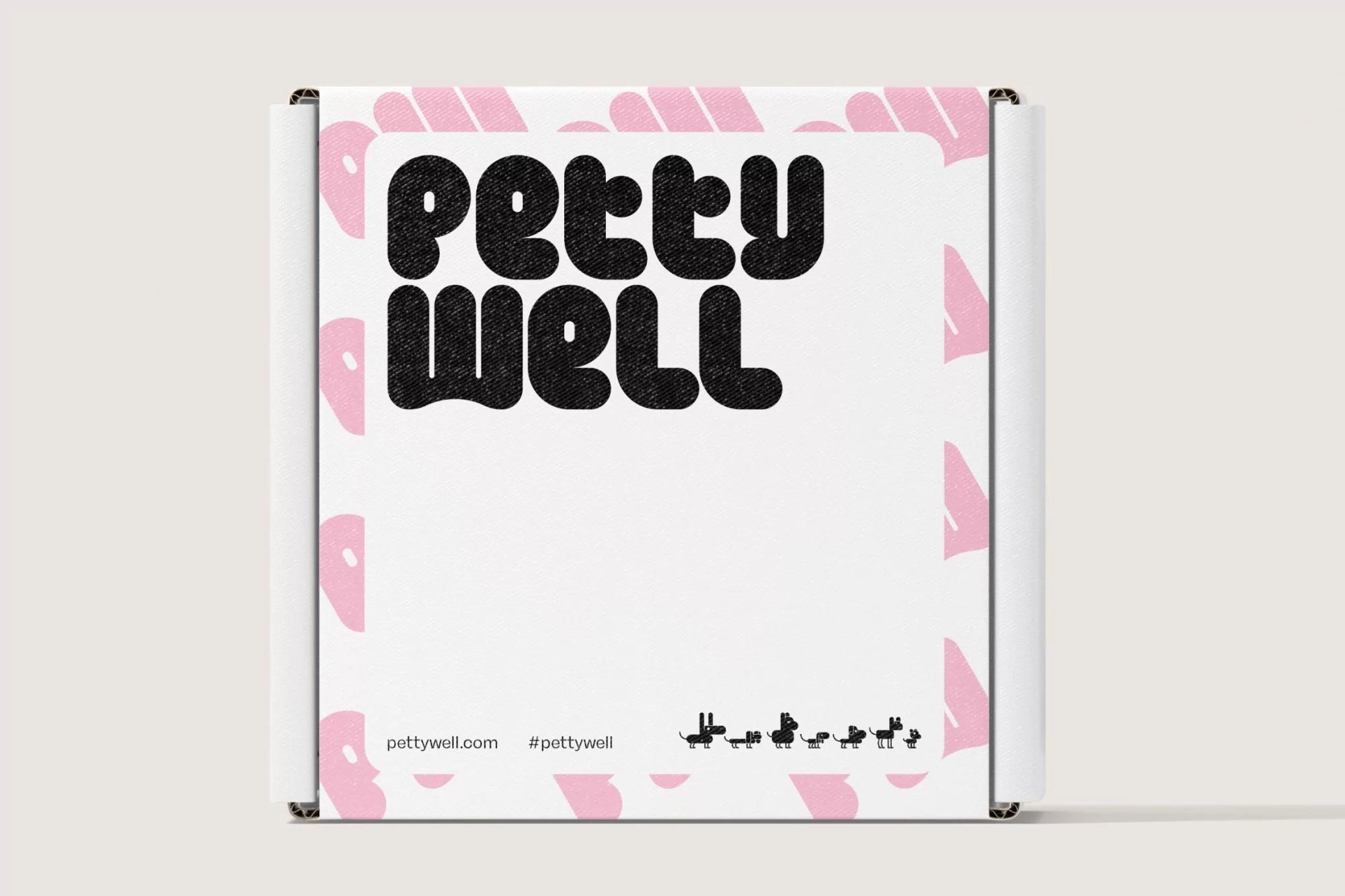 Cardboard box with a white label featuring the text "PETTY WELL" in bold black letters, plus a series of black dog silhouettes.