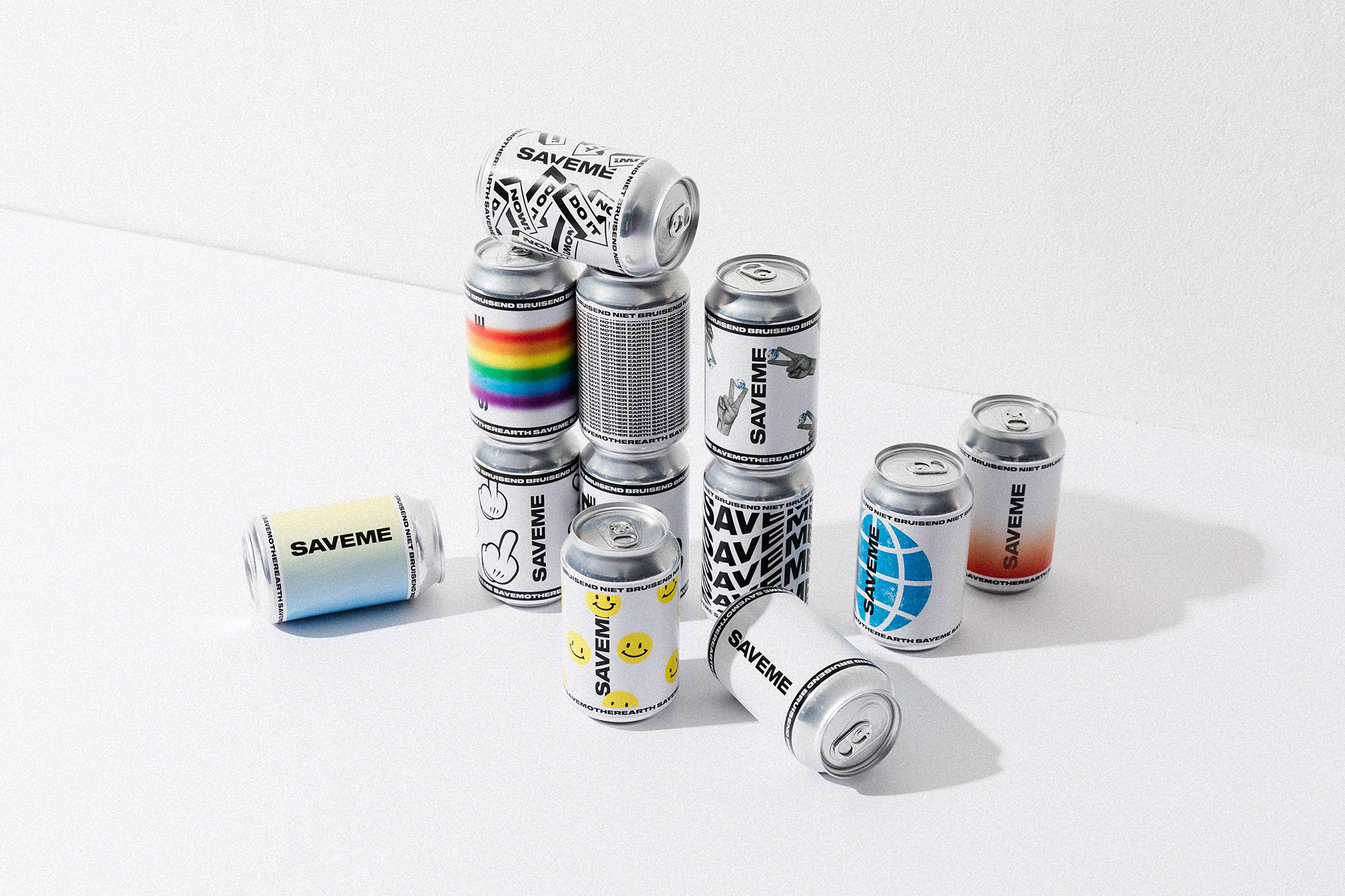 Collection of silver aluminum cans, some stacked, with various colorful graphic designs and text on white background, studio lighting.