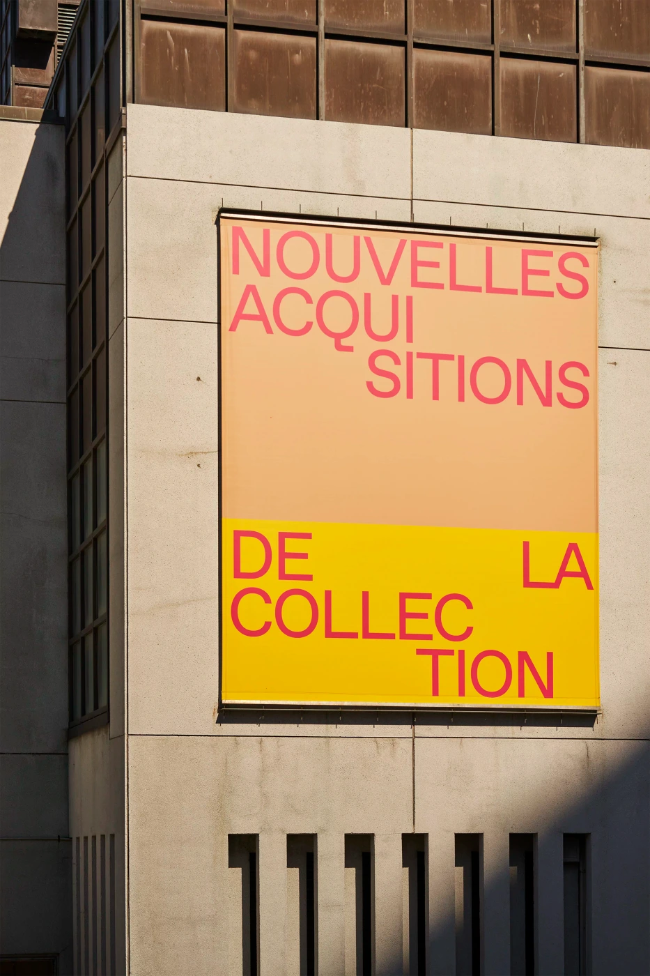 Large exhibition banner with red typography reading NOUVELLES ACQUISITIONS DE LA COLLECTION on a concrete building exterior