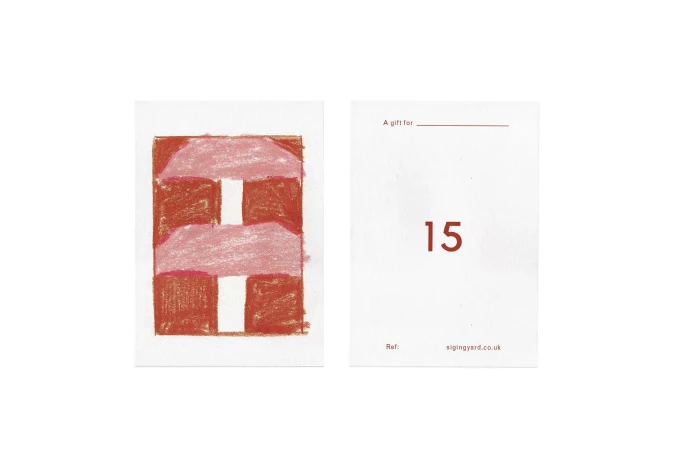 Two gift cards with geometric drawing, one with value '15'. Simple abstract artwork on white card stock.