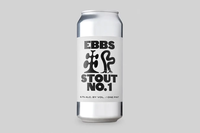 Aluminum can of stout beer with a label featuring black text and graphic art, set against a solid light gray background in studio lighting.