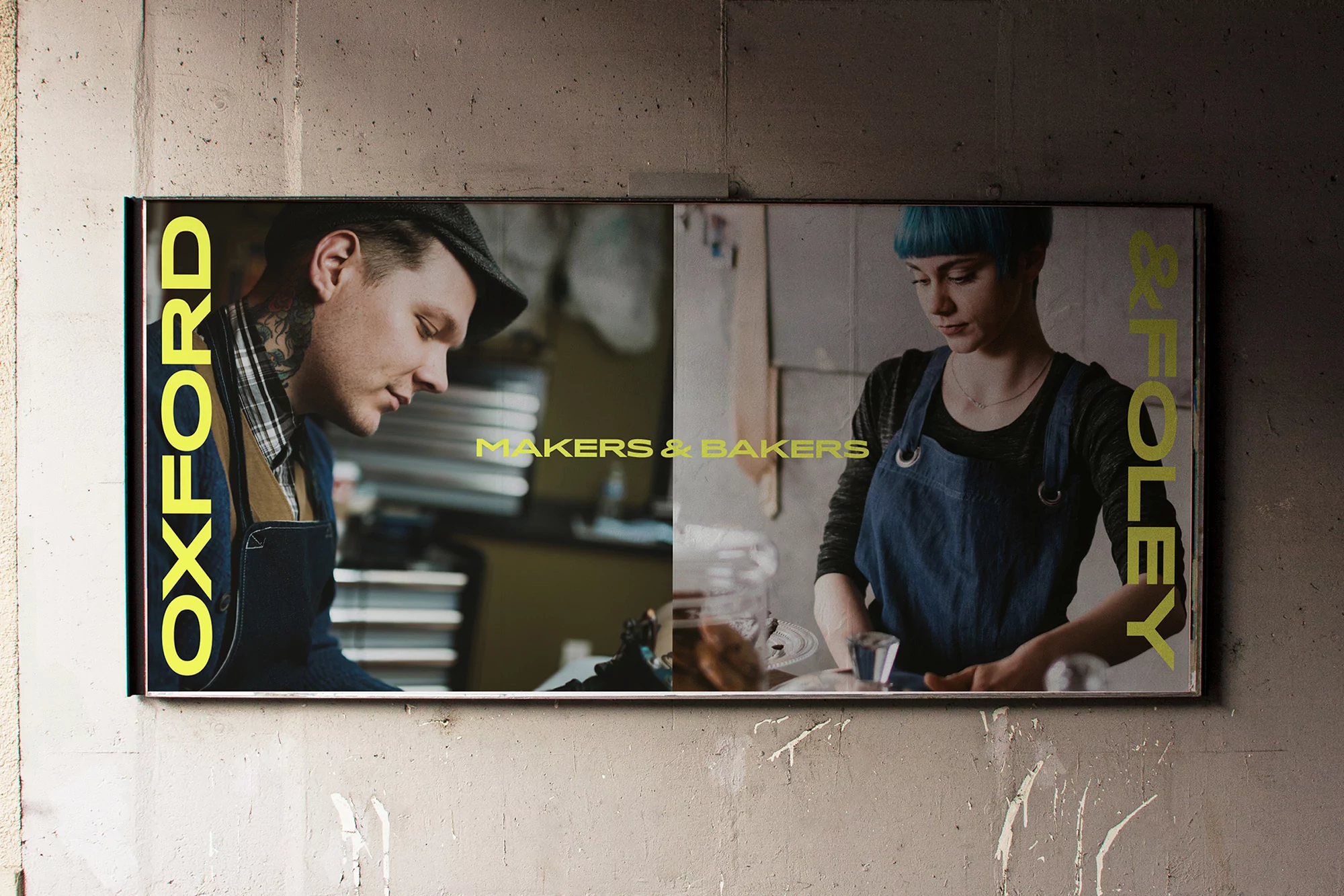 Outdoor billboard featuring two portraits of artisans with bold yellow typography reading Oxford and Foley Makers and Bakers