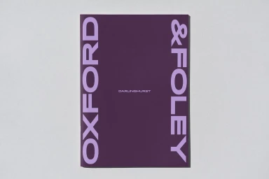 Purple book cover with large lilac typography reading OXFORD & FOLEY and smaller text reading DARLINGHURST on a light grey background.