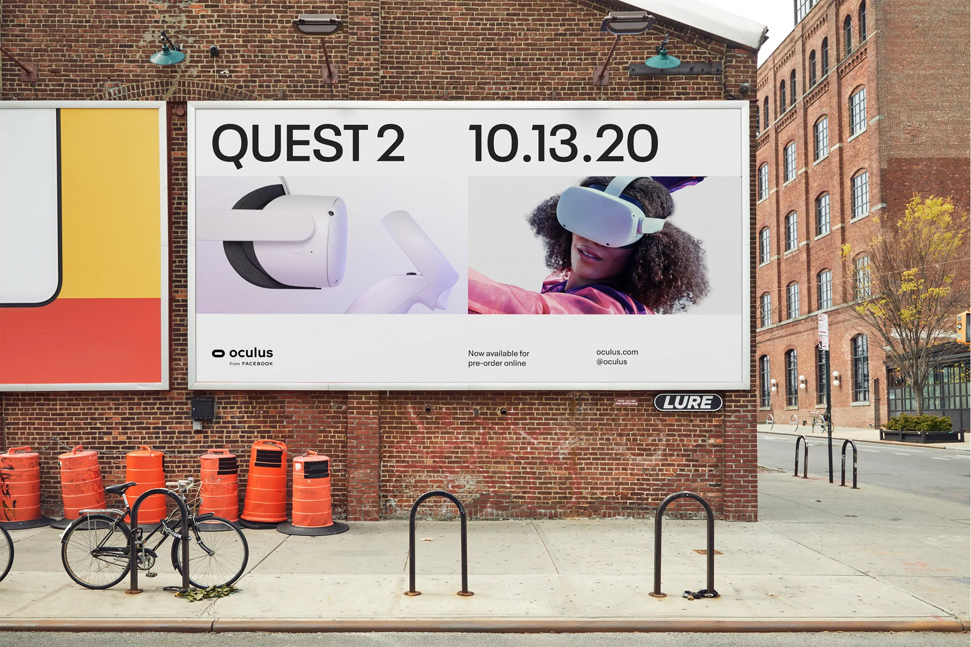 Large outdoor advertising billboard on a red brick building exterior featuring Oculus Quest 2 branding and product imagery.