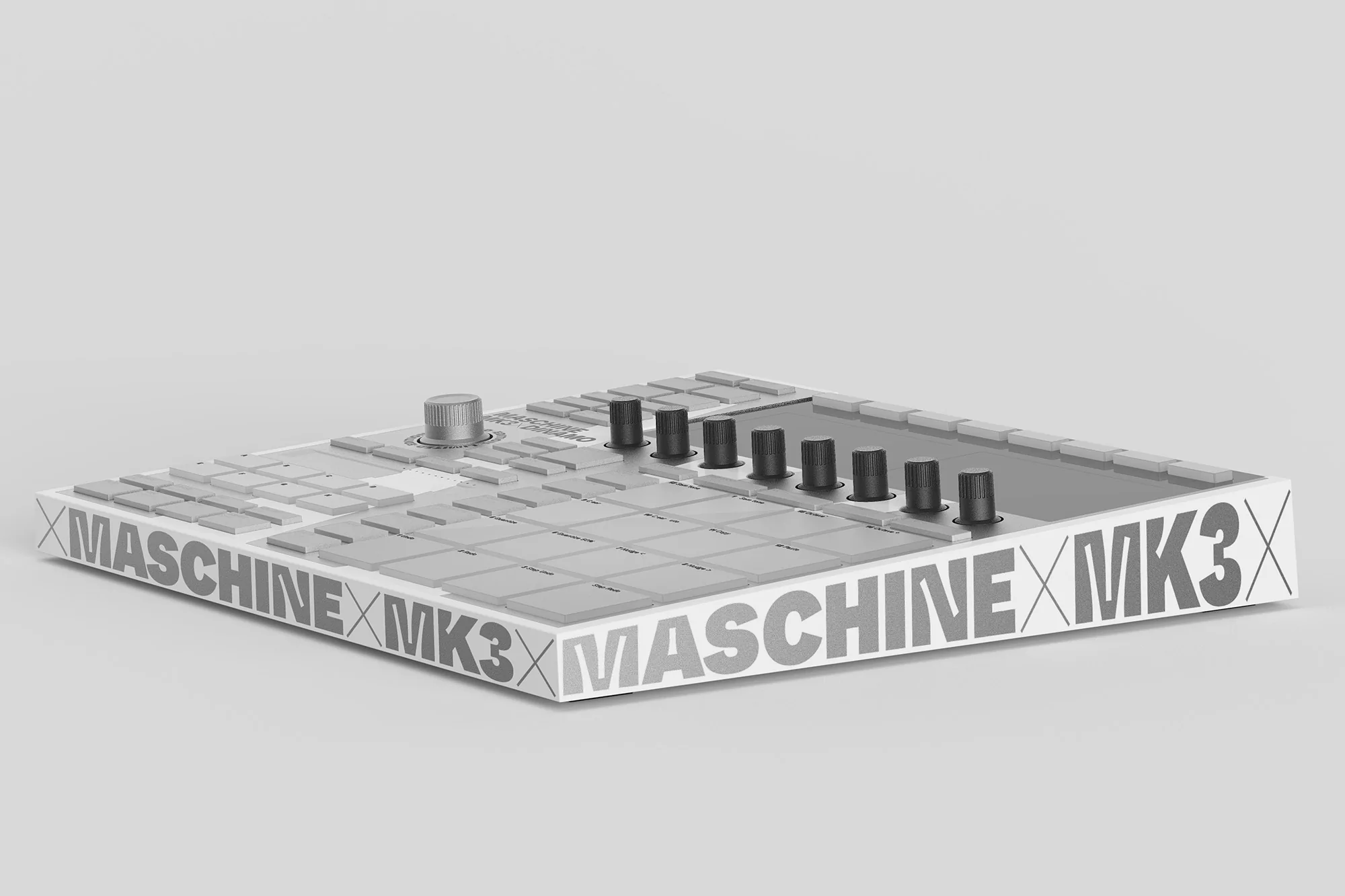 Close-up studio shot of a Maschine MK3 music production controller, featuring a gray and white color scheme and visible text.