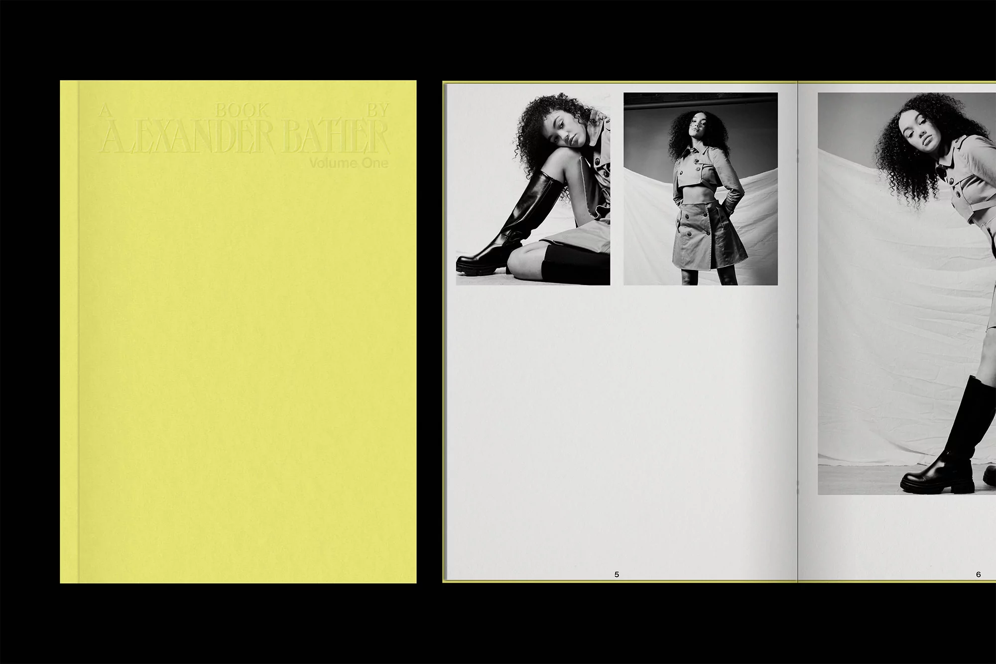 Fashion magazine double-page spread featuring black and white photos of a woman in stylish outfits, next to a solid yellow book cover.